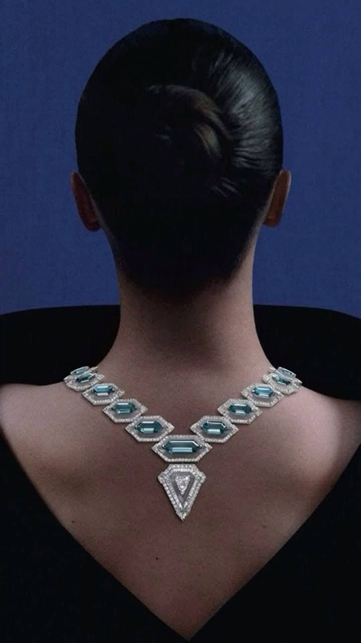 Aquamarine and diamond necklace worn down the nape of the neck